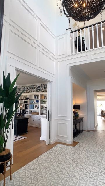 2 Story Foyer Wainscoting Entryway, Tall Ceiling Foyer, Wainscoting 2 Story Living Room, 2 Story Foyer Wall Ideas, Grand Foyer Ideas Entryway, Foyer Wainscoting Entryway, Entryway Paneling, Grand Foyer Ideas Entryway Entrance, Decorating Tall Walls High Ceilings