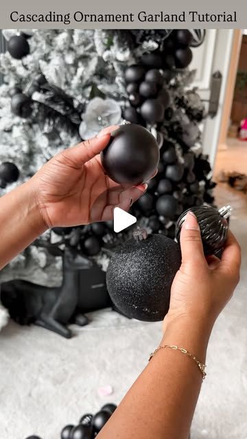 Tina Meeks on Instagram: "How to create Cascading Ornament Garland + Luxe Design Tree Look...  SAVE this for inspiration for decorating your Christmas tree. You’ll need floral wire + ornaments of different sizes and some patience. I went with black but it’ll look amazing in any color.   I used 15-20 ornaments per cluster. About 8 full clusters on this 7.5 foot tree. Be sure to double loop the first and last ornament or they’ll slide all over the place. Happy Decorating!!🖤" Black Blue Christmas Tree, Cascade Ornaments On Tree, Bulb Cluster On Tree, Grouping Christmas Balls On Tree, Flocked Tree With Black Ornaments, Christmas Tree Ornament Garland, Bauble Cluster On Tree, Cascading Ornaments On Tree, Christmas Tree Cluster Ornaments