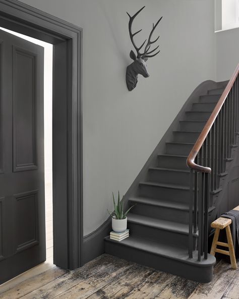 How fab is this grey hallway? We love the combination of the darker woodwork and the pale walls. #hallway #stairs #grey #realhomes Grey Hallway, Gray Stairs, Hallway Paint, Painted Staircases, Hallway Colours, Dark Hallway, House Staircase, Hallway Inspiration, Hallway Designs