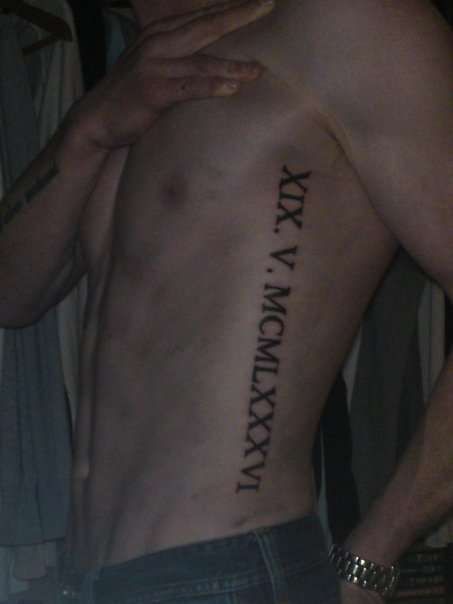 Roman Numeral Rib Tattoo Men, Roman Numeral Rib Tattoo, Side Rib Tattoo Men, Side Tattoos For Men Ribs, Ribcage Tattoo Men, Ribs Tattoo Men, Numerical Tattoos, Roman Numeral Tattoo Men, Rib Tattoo Men