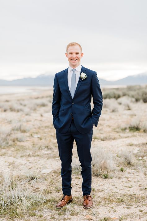 Groom with navy blue suit, light blue tie and brown shoes and belt  Dreamy Winter Bridal Session at Antelope Island || Utah Wedding Photographer || Syracuse, Utah || Photography by Tasha Rose Navy Suit Winter Wedding, Navy Blue Suit With Dusty Blue Tie, Navy Blue Suit Light Blue Tie, Navy Suit Dusty Blue Tie, Navy Blue Suit With Brown Shoes, Dark Blue Suit With Brown Shoes, Navy Suit Brown Shoes Wedding, Navy Suit With Blue Tie, Black Tux With Light Blue Tie