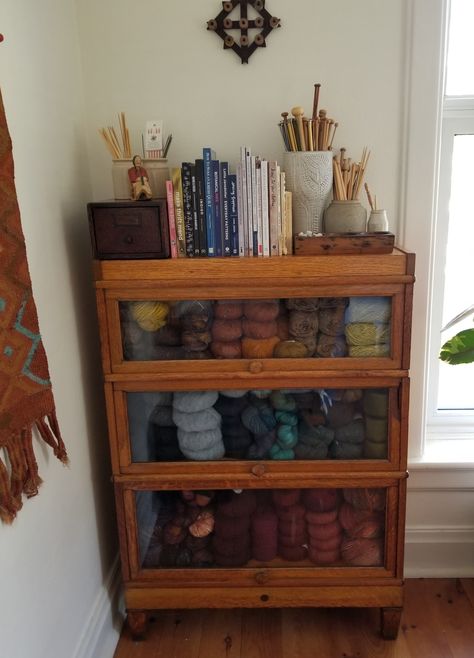 Keeping my yarn safe in a vintage barristers case Cute Craft Storage, Yarn Storage Craft Room, Bookcase With Curtain, Storage For Yarn Ideas, Craft Room In Closet, Ladder Organization Ideas, Yarn Cabinet Storage, Cubic Organizer Decor Ideas, Cute Yarn Storage Ideas