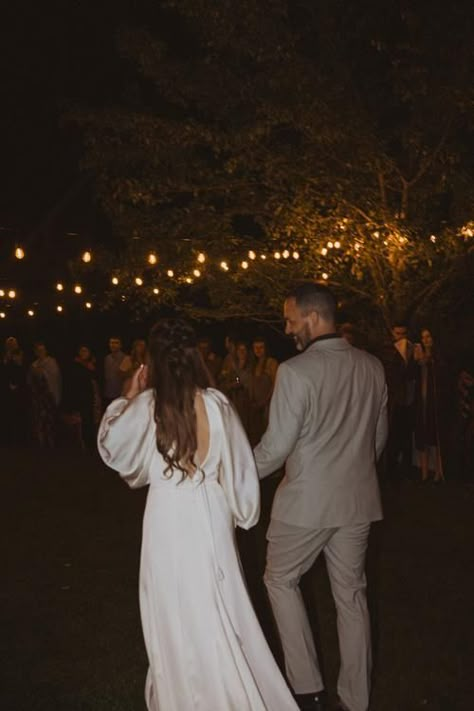 backyard post elopement party, father daughter dance outside with patio string lights. bride wearing long sleeve wedding dress by Watters Post Elopement Party Backyard, Surprise Elopement Party, Wedding Party After Elopement, Backyard Elopement Party Receptions, Backyard Elopement Reception, Elopement After Party Ideas, Small Wedding Party Ideas, Elopement Party Backyard, Post Elopement Party Ideas