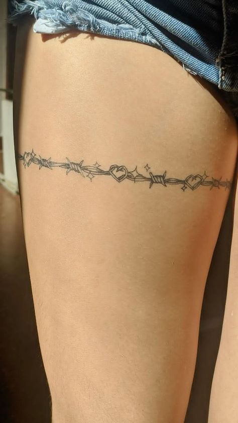 Barbwire Around Arm Tattoo, Knife With Barbed Wire Tattoo, Heart With Barb Wire Tattoo, Barbed Wire Back Tattoo, Barb Wire Tattoo Around Thigh, Barb Wire Tattoo Around Leg, Barbed Wire Tattoo Around Leg, Garder Thigh Tattoos For Women, Barb Wire With Flowers Tattoo