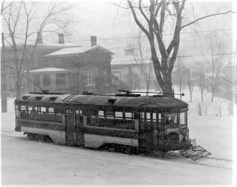 A big NY State Railways Peter Witt car pushes through downtown Syracuse NY in a late 1940 snowstorm. NY State Railways was formed in 1909 by the NY Central Railroad to consolidate their many traction properties. NYSR operated an extensive interurban system as well as city lines in Rochester, Syrauce, Utica, Oneida and Rome NY. The Syracuse Division once operated 88 miles of city lines, with the change-over to buses beginning in 1924. The last day for Syracuse streetcars was January 4, 1941. Syracuse New York, Syracuse Ny, January 4, Snow Storm, The Last Day, Buses, Last Day, Division, Rome