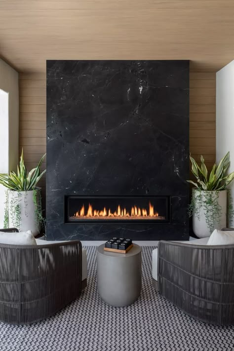 25 Outdoor Fireplace Ideas That Are Warm and Cozy Outdoor Tiled Fireplace, Tiled Outdoor Fireplace, Linear Fireplace Tile Surround, Dekton Fireplace, Dark Fireplaces, Black Modern Fireplace, Black Fireplaces, Black Marble Fireplace, Slate Fireplace Surround