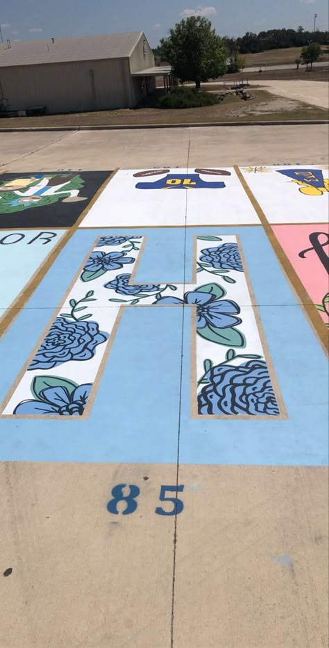 Alice In Wonderland Senior Parking Spot, Dinosaur Parking Spot, Blue And White Parking Spot, Student Parking Lot Painting, Volleyball Parking Spot Painting, Group Parking Spot Ideas, Group Senior Parking Spot Ideas, Blue Parking Spot Ideas, Senior Parking Spot Ideas Simple