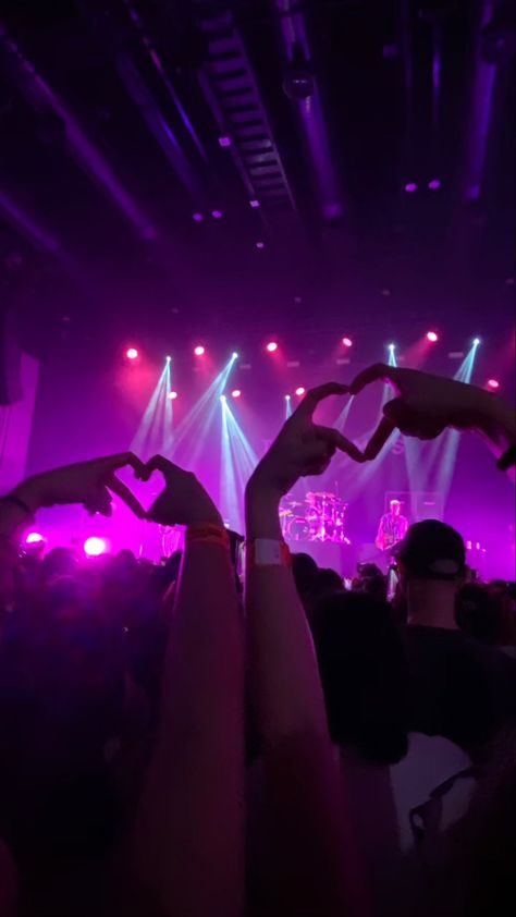 The Vamps Greatest Hits Tour in Bangkok, Samyan Mitrtown Hall, 10 February 2023. Making heart hands signs at concert, hand picture posing, concert photo ideas, posing inspo, The Vamps, Brad Simpson, Connor Ball, Tristan Evans, James McVey, Purple concert lights, purple neon aesthetic, neon lights, small gig venues, nostalgia, core memory, y2k aesthetic, bands, british band, world tour, purple computer background, purple wallpaper, neon screensaver Purple Wallpaper Neon, Purple Computer Background, Small Concert Aesthetic, Purple Neon Aesthetic, Purple Concert, Purple Computer, Aesthetic Neon Lights, The Vamps Concert, Concert Photo Ideas