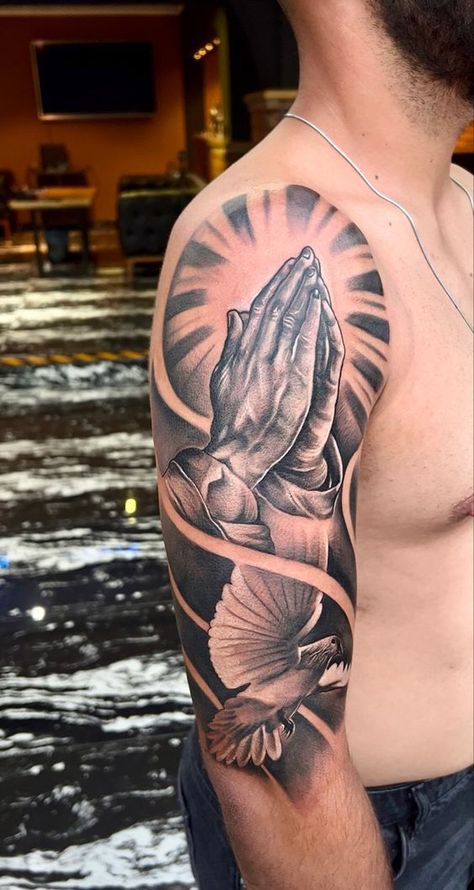 If you have been looking for unusual tattoo designs with praying hands for a long time, then our article is for you. We have collected 55+ of the most interesting and their meanings in human life. Upper Hand Tattoo Men, Praying Hands Tattoo Sleeve, Half Upper Sleeve Tattoo Men, Praying Hands Tattoo Shoulder, Men’s Upper Arm Tattoos, Pigeon Tattoo Men, Praying Hands Tattoo For Men, Upper Arms Tattoo, Jesus Praying Tattoo