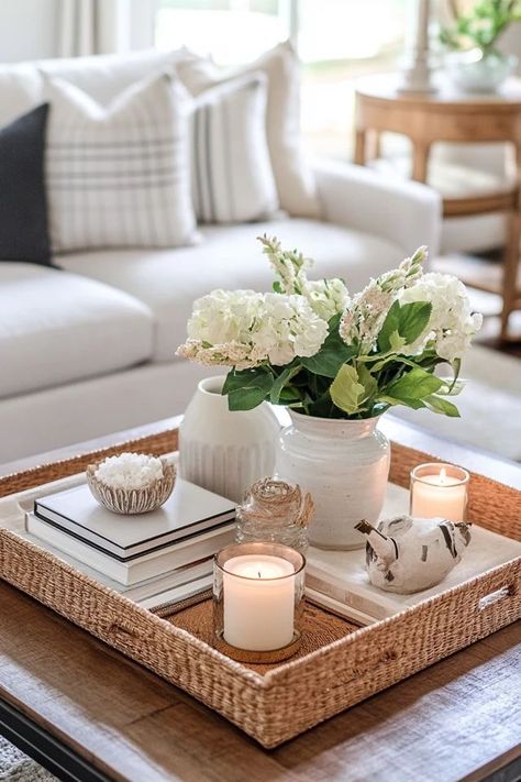 "Add a touch of elegance with Decorative Tray Styling! 🛋️✨ Perfect for organizing and displaying your favorite items in style. 🌟✨ #TrayStyling #HomeDecor #InteriorInspiration" Display Tray Ideas, Center Table Tray Decor, Large Ottoman Tray Decor Ideas, Styled Coffee Table, Ottoman Decor Living Room Tray, Table Basket Decor, Living Room Ottoman Decor, Wicker Tray Decor, Coffee Table Tray Styling