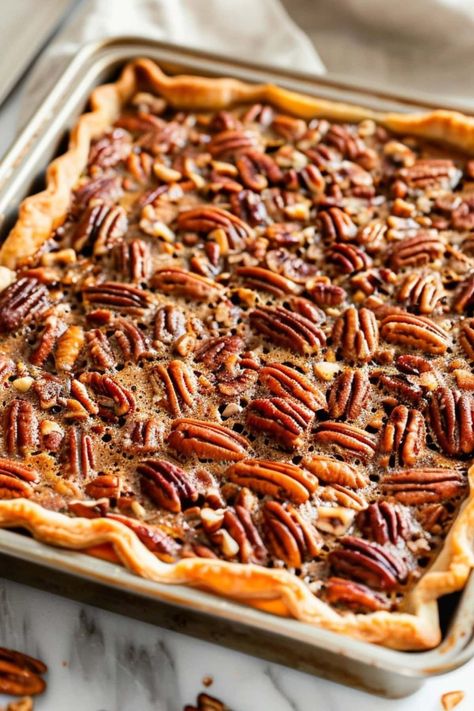 This quick and simple pecan slab pie recipe takes the classic flavors of pecan pie and transforms it into an effortless dessert that easily feeds a crowd. Pecan Pie Bars With Store Bought Crust, Pecan Slab Pie 12 Tomatoes, Pecan Sheet Pan Pie, Slab Pecan Pie Recipe, Slab Pecan Pie, Pecan Slab Pie Recipe, Pecan Pie Dough Recipe, Slab Pies For A Crowd, Pecan Pie Puff Pastry