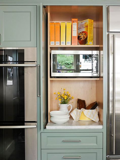 Slide-back doors keep microwave accessible while also having the option to conceal it for a clean look. Hidden Microwave, Microwave Cabinet, Appliance Garage, Kabinet Dapur, Hidden Kitchen, Pantry Cabinet, Kitchen Remodel Ideas, Trendy Kitchen, Kitchen Remodel Idea