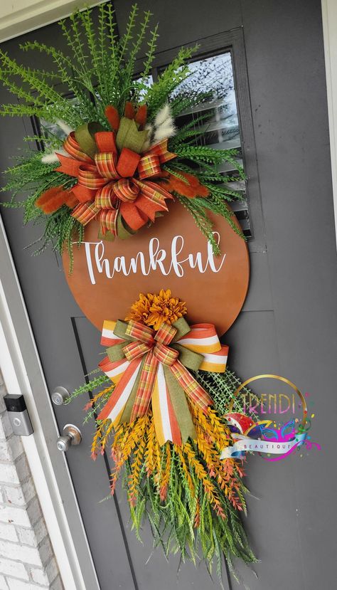 Feeling absolutely grateful, thankful, and blessed in this season. This new Fall Swag is perfect for bringing in all the Fall VIBEZ! 🤎🧡 It's the perfect mixture of nostalgia and elegance bringing in all the Fall colors. Looking at this gorgeous door hanger swag brings me so much joy and reminds me of all the blessing of the season! Let's embrace the blessings of this season together! Diy Fall Door Hangers, Fall Decor Wreaths, Wooden Wreath, Fall Swags, Gorgeous Doors, Swag Wreath, Door Swag, Door Wreaths Fall, Wreaths Ideas