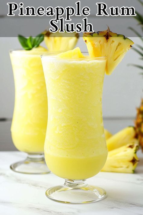 Pineapple Rum Slush is a refreshing frozen cocktail bursting with tropical flavor. Made with frozen pineapple chunks, pineapple juice, simple syrup, rum, and ice, this slushy drink is a perfect way to cool down and relax on a hot day. Pineapple Slushie Recipe, Adult Slushies Frozen Drinks, Rum Slush Recipe, Frozen Alcoholic Drinks Slushies, Rum Slush Recipe Frozen, Pineapple Alcohol Drinks, Frozen Pineapple Cocktail, Frozen Alcoholic Drinks Slushies Slush Recipes, Pineapple Rum Slush