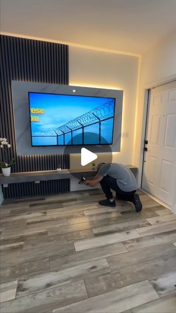 Dekowood | Wood Slats | TV Walls on Instagram: "Minimalist entertainment center" Wooden Slat Wall Living Room Tv, Slatted Wall Tv Unit, Wooden Slat Media Wall, Slatted Wall Interior Tv, Tv Slat Wall, Slated Wood Tv Wall, Minimalist Entertainment Center, Slat Wall Tv, Slat Wall Ideas