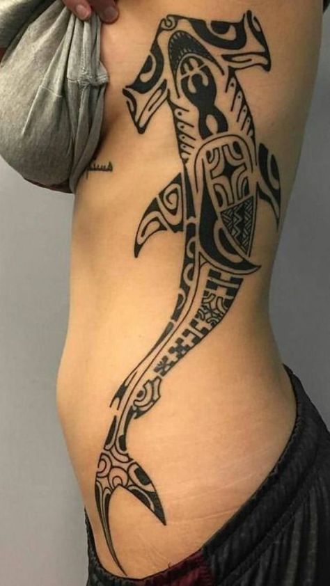 Dive into the deep with shark tattoo ideas. Explore designs that capture the strength and majesty of these fascinating ocean predators. Shark Sleeve Tattoo For Men, Whale Shark Tattoo Traditional, Shark Wrap Around Tattoo, Surfing Skeleton Tattoo, Tattoo Ideas For Swimmers, Ribcage Star Tattoo, Marine Life Spine Tattoo, Hawaiian Shark Tattoo, Shark Tattoo On Ribs