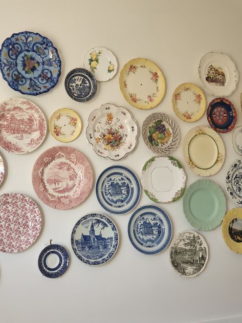 The vintage plates are all sourced from thrift stores.  Credit: Collette Vintage Wall Plates, Thrifted Plates For Wedding, Wall Of Plates Decor, Decorative Plate Wall Display, Vintage Kitchen Dishes, Vintage Plate Wall Decor, Kitchen Plate Display, Cute Plates Set, Trinket Collection Aesthetic