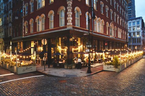 Many restaurants have had to be creative in order to deliver outdoor dining, but few have worked harder than La Mercerie. The popular Parisian café in New York City’s SoHo neighborhood has built six-inch platforms to elevate guests from the street with planters placed at each end. La Mercerie will be able to accommodate 88 seats outside, which is almost double the previous indoor capacity.  See link for full story. #elitetraveler New York Restaurants Aesthetic, Restaurant Outside, Neighborhood Restaurant, Restaurants Nyc, Dream Bakery, Romantic Restaurants, Restaurant Exterior, Roman And Williams, Air Tent