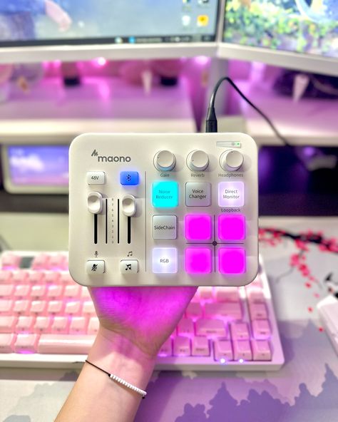 Have you guys checked out this audio mixer from @maonoglobal yet?! - This Maonocaster G1 NEO Audio Mixer has been my go-to every single day I play games! My favorite features are being able to mute my music easily and it can mute my microphone!! - With such a sleek design with vibrant RGB lights. @maonoglobal did an amazing job with this product! How can find it linked in my bio! 🛍️ - ❀ You can find everything from my setup, linked in my bio!! ⚘ - 🅃🄰🄶🅂 ──❀*̥˚───❀*̥˚─┐ - Cozy desk •°. Gamer ... Twitch Tips, Setup Accessories, Pink Setup, Aesthetic Tech, Tech Setup, Cozy Gamer, Tech Room, Ear Monitors, Gamer Stuff