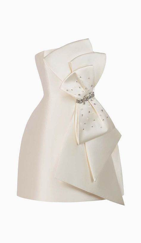 Strapless Bow Mini DressElevate your style and embrace your inner princess with our Strapless Bow Mini Dress. This stunning dress is designed to make you feel like royalty, featuring a playful oversized bow that cascades down the front, exuding a charming fairy tale vibe.The strapless neckline of this dress is designed to flatter your décolletage, adding an elegant touch to your overall look. The ivory color adds a touch of sophistication and grace, making it the perfect choice for any special o Snowcoming Dresses, Coquette Party, Bow Mini Dress, Fancy Short Dresses, Bow Wedding Dress, Junior Prom Dresses, Womens Prom Dresses, Strapless Sweetheart Neckline, Strapless Neckline