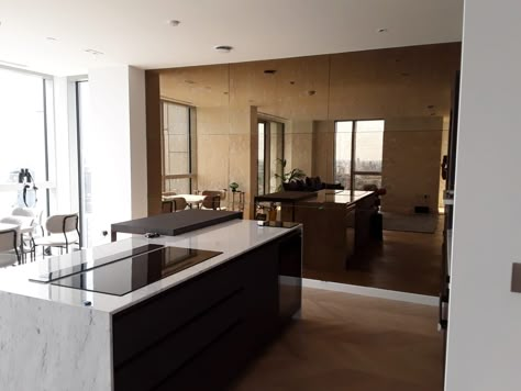 View our full wall paneling of bronze marbled mirror glass. Apartment Open Plan, Bronze Mirror Panelling, Bronze Mirror Splashback, Bronze Mirror Wall, High Ceiling Living Room Modern, Ceiling Living Room Modern, Mirror Panelling, Mirror Wall Design, Mirror Panel Wall