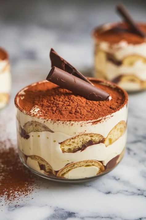 A photo of a  Tiramisu a christmas dessert recipe Tiramisu For A Crowd, Best Winter Dessert Recipes, Cupped Desserts, Holiday Tiramisu, Tiramisu Christmas, Dessert For Christmas Dinner, Christmas Tiramisu, New Years Desserts, New Years Dessert