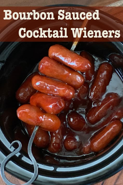 Bourbon Sauced Cocktail Wieners stacked on a skewer are balanced on top of a small crockpot filled with the hotdogs simmering in the bourbon sauce. Cocktail Weiners, Crockpot Party, Crockpot Party Food, Cocktail Wieners, Football Apps, Little Smokies Recipes, Party Food Dips, Cocktail Weenies, Easy Make Ahead Appetizers