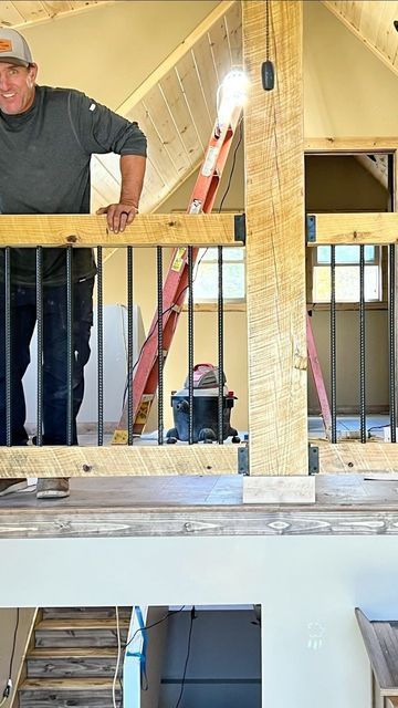 Erik Perkins on Instagram: "Watch how we built this cool railing out of rebar and Timbers #rustic #loghome #railing #rebar #woodworking #building #construction" Vertical Rebar Railing, Rebar Railing Stairs, Rustic Loft Railing, Rebar Balusters, Diy Rebar Railing, Deck Railing With Rebar, Rebar Railing Porch, Rebar Stair Railing, Loft Stair Railing Ideas