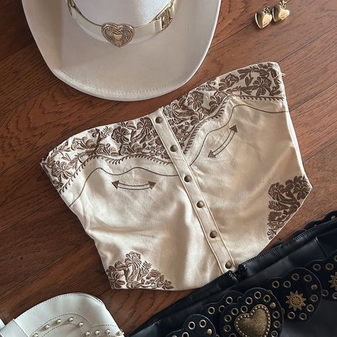 our best selling top, now in 3 colors 🖤 product: faux suede western embroidered strapless corset top in cream, brown and black . . . . western style, western corset top, trending style, western boutiques, country boutiques, country concert outfits, nashville outfits, cute western outfits, bachelorette party outfits Cowgirl Shirts Westerns, Western Style Fashion, Western Festival Outfits, Acl Outfits Festivals, Western Birthday Outfit, Western Wear Ideas, Bandana Shirt, Look Western, Subtle Embroidery