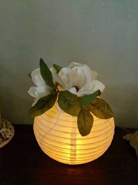 We used paper lanterns with a LED  tea light for centerpiece's at our class reunion. We hot glued a wide mouth bell jar lid on the bottom for a base so it would stand on the table. We used silk magnolias on the top to fill the hole. Paper Lantern Centerpieces, Diy Paper Lanterns, Princess Tiana Birthday Party, Tiana Birthday Party, Class Reunion Decorations, Reunion Decorations, Paper Lanterns Diy, Deco Champetre, Lantern Centerpieces