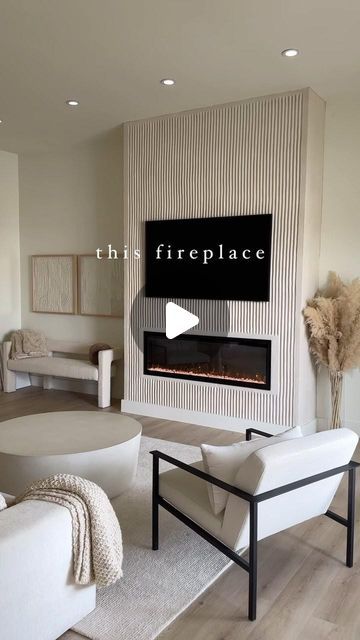 Sage Coralli Wilson on Instagram: "finally able to share some of our home reno!! This house was the most massive project that took over our lives the past year. A labor of love for sure (especially for my hubs @dkwilson16), but we are loving how it’s coming along. Most frequently asked question lately is about our fireplace, so here are the details ⬇️: 1. Material - stucco, troweled by hand, .5” spacing for trowel lines. 2. Electric fireplace unit — I don’t love the one we have, but we already purchased it before knowing we would make this our personal home, so we stuck with it. It does give off heat and you can change the color settings on it! 3. Box cutout behind tv for tv boxes & cables — we love this feature for mounting TV & hiding cords. TV is @samsung Frame TV 65” for size refer Two Story Electric Fireplace, Convert Gas Fireplace To Electric, Unique Electric Fireplace Ideas, Fluted Stone Fireplace, Asymmetrical Fireplace Built Ins, Fluted Fireplace Wall, Diy Stucco Fireplace, Fireplace Not Centered On Wall, Cabinets Next To Fireplace