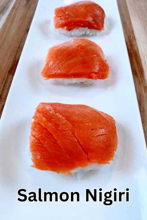 A simple yet flavorful sushi, salmon nigiri is widely popular throughout the world. The vinegar flavor of the sushi rice enhances the flavor of the salmon bringing out the best in each ingredient. In addition, it's a very quick sushi to make! Nigiri Recipe, Cooking Sushi Rice, Smoked Salmon Sushi, Cooking Sushi, Salmon Nigiri, Sushi Salmon, Sushi Go, Gluten Free Salmon, Sushi Vinegar