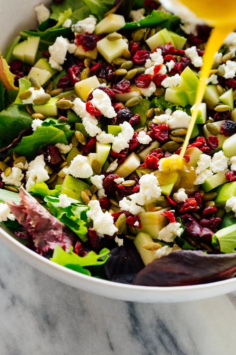 Meet my FAVORITE green salad—it's the perfect fresh side for cold weather meals! This simple and delicious green salad features apple, pepitas (pumpkin seeds), cranberries and goat cheese! #cookieandkate #greensalad #salad #healthyrecipe #thanksgiving Green Salad For Thanksgiving, Green Salad With Apples, Fall Salad Ideas, Easy Fall Salad, Toasted Pepitas, Cold Weather Meals, Gluten Free Monster Cookies, Pumpkin Seed Salad, Green Apple Salad