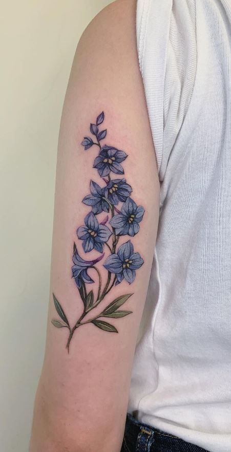 Larkspur Sleeve Tattoo, Art Nouveau Larkspur, Filler Designs For Tattoos, Larkspur Hip Tattoo, Purple Larkspur Tattoo, Blue Larkspur Tattoo, Larkspur Birth Flower Tattoo, Blue Star Flower Tattoo, Tall Flower Tattoo