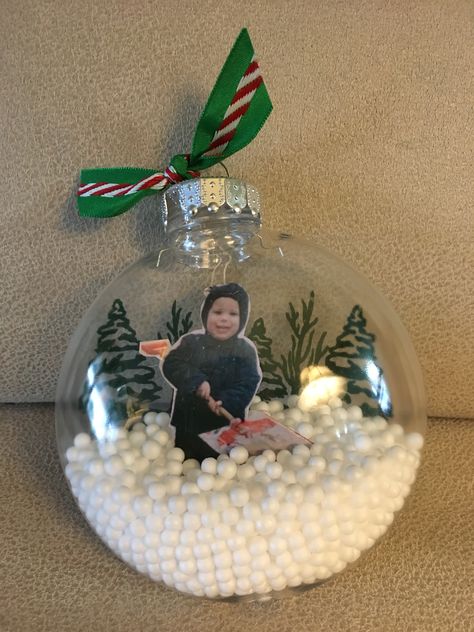 Kids Snow Globe Ornament, Empty Ornament Ideas Kids, Plastic Ornaments Diy Kids, Ball Ornaments Diy Christmas Kids, Diy Christmas Ornaments For Grandparents, Kids Ornament Craft Clear Ball, Child Led Christmas Crafts, Picture In Ornament Ball Diy, Christmas Picture Ornaments Diy