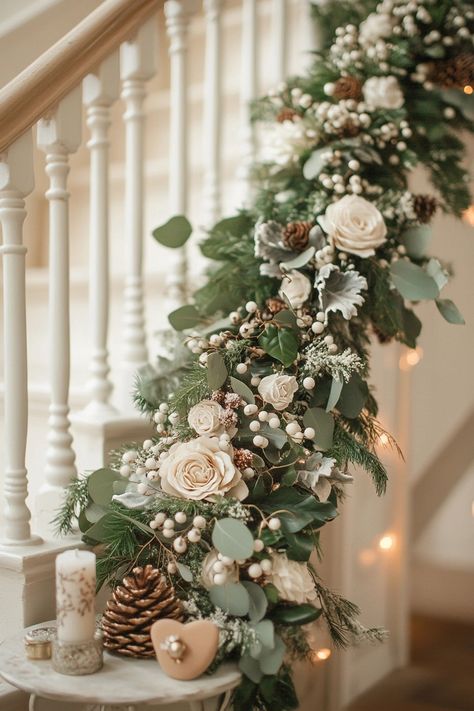 Transform your space with luxurious Christmas home decor. This elegant garland with white roses, pinecones, and lush greenery brings a winter wonderland indoors. Perfect for adding a sophisticated touch to your festivities. #ChristmasHomeDecor #HolidayStyle #ElegantDecor Roses Christmas Decor, White Christmas Staircase Decor, Decorated Stairs, Christmas Staircases, Christmas Stairway, Christmas Shop Displays, Christmas Garland On Stairs, White Christmas Garland, Christmas Banister