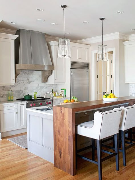 In need of extra dining space but not willing to give up valuable preparation area on the island? Place a tall bar table next to the island using complementary materials -- in this kitchen, that means a stained-wood countertop. An island extension such as this offers a place for eating meals and doing homework. Eat In Bar Kitchen, Eat In Island Kitchen, Eat In Kitchen Island, Kitchen Island Bar Ideas, Fun Kitchen Island, Kitchen Island Extension, Kitchen Island Bar Height, Island Extension, Miami Townhouse