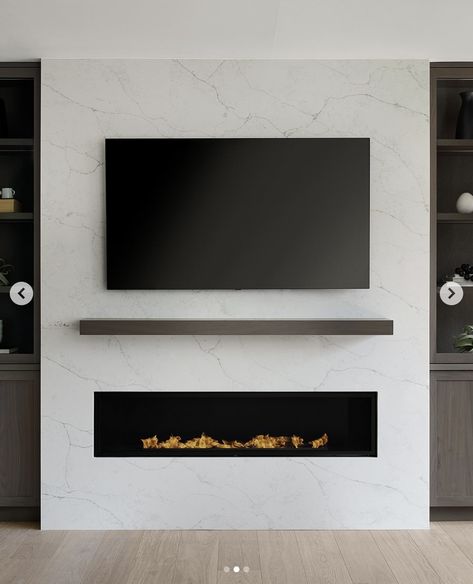 25 Practical Yet Beautiful Electric Fireplace With TV Above Ideas Foyer Tv Mural, Bedroom Tv Fireplace Wall, Tv Over Gas Fireplace, Electric Fireplace Ideas Bedroom, Electric Fireplace With Tv Above, Electric Fireplace With Tv, Tv Unit Table, Luxurious Living Room Ideas, Fireplace With Tv Above