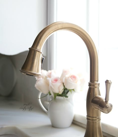 A faucet with a champagne bronze finish adds elegance to the farmhouse sink.   - CountryLiving.com French Cottage Kitchen, Bronze Kitchen Faucet, Nail Art Flower, Farmhouse Sink Faucet, French Country Kitchens, Country Chic Cottage, Home Floral Arrangements, Cottage Kitchens, Wallpaper Flower