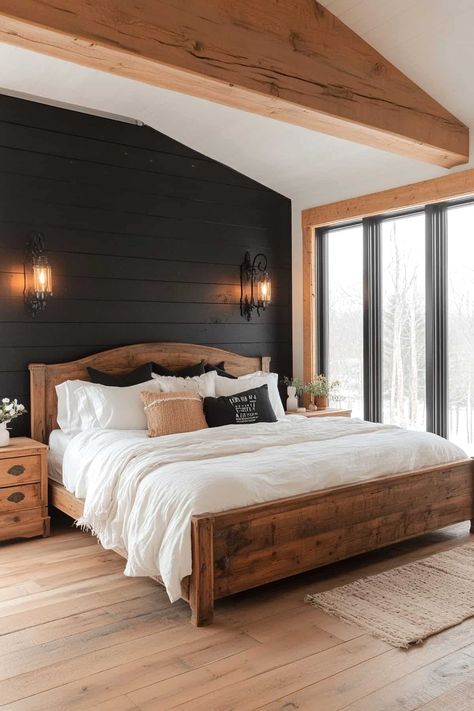 Cozy rustic bedroom featuring a striking black accent wall and wooden decor elements. Black Wood Plank Wall, Bedroom Interior Dark Theme, Black Shiplap Bedroom Wall, Painted Wood Accent Wall Bedroom, Master Bedrooms With Accent Wall Shiplap, Black Wall In Master Room, Black Rustic Home Decor, Bedroom With Wood Slat Wall, Colored Accent Wall Bedroom