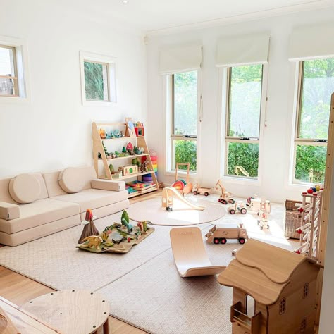 Montessori Toddler Playroom for Joyful Discovery Montessori Playroom 12 Months, Montessori Playroom Layout, Preschool Playroom At Home, Daycare Living Room, Multi Age Playroom, Montessori Art Space, Dining Room Playroom Conversion, Toddler Play Area In Living Room, Toddler Montessori Room