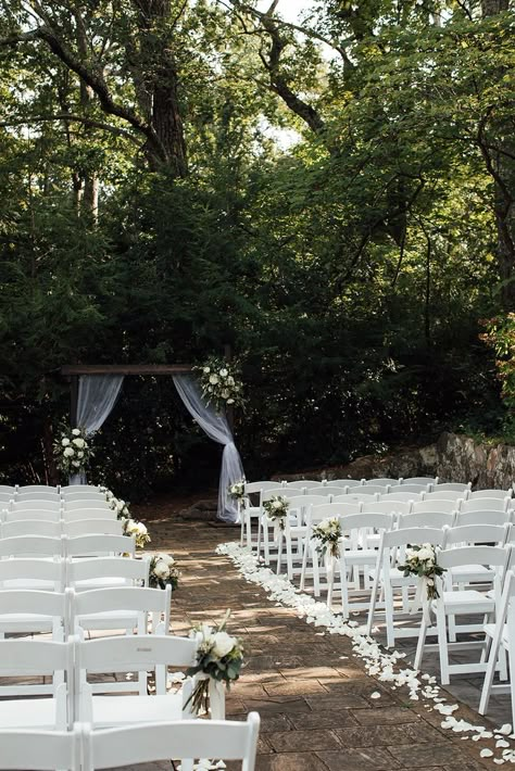 Chair Ceremony Decorations, White Rose Wedding Aisle Decor, Wedding Aisle With Petals, Aisle Set Up Wedding, Rose Petal Lined Wedding Aisle, White Flowers Lining Aisle, Chairs At Wedding Ceremony, Parking Lot Wedding Ceremony, Chair Set Up For Wedding Ceremony