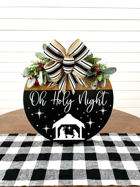 Celebrate the Holy Night with this stunning Christmas door hanger!  Choose from a wreath, manger scene, or Jesus-themed design.  Perfect for adding a touch of festive cheer to your home this Christmas.  Get inspired by our other creations: Grinch Christmas Door Hanger, Cricut Christmas Wooden Signs, or even a Black Christmas Door Hanger.  Check out our DIY options like Round Wood Christmas Door Hanger, Round Wooden Door Hangers, or a Gingerbread Man Door Hanger.  Perfect Christmas Crafts For Adults!  Find your perfect Oh Holy Night Door Hanger today! #HolyNight #ChristmasDoorHanger #ChristmasCrafts #DIYChristmas #ChristmasDecor #Wreath #Manger #Jesus #Grinch #Cricut #BlackChristmas #RoundWoodDoorHanger #Gingerbread Chritmas Door Hangers, Santa Hat Door Hanger Diy, Cricut Christmas Wooden Signs, Dollar Tree Cricut Projects Christmas, Christmas Crafts For Adults Decoration, Black Christmas Door Hanger, Manger Door Hanger, Oh Holy Night Door Hanger, Round Wood Christmas Door Hanger