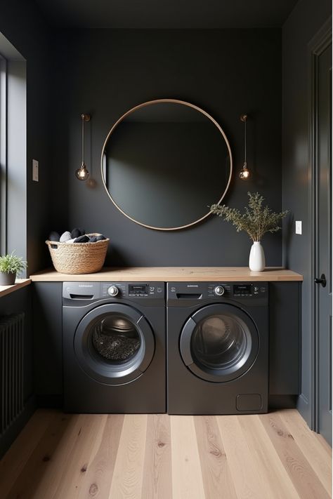 Minimalist laundry room with dark walls and light wood accents Cool Laundry Room Ideas Modern, Bold Moody Interior Design, Moody Utility Room, Sage Green And Black Laundry Room, Laundry Room Ideas With Black Appliances, Dark Utility Room Ideas, Dark And Moody House Interiors, Black Wall Laundry Room, Utility Room Paint Color Ideas