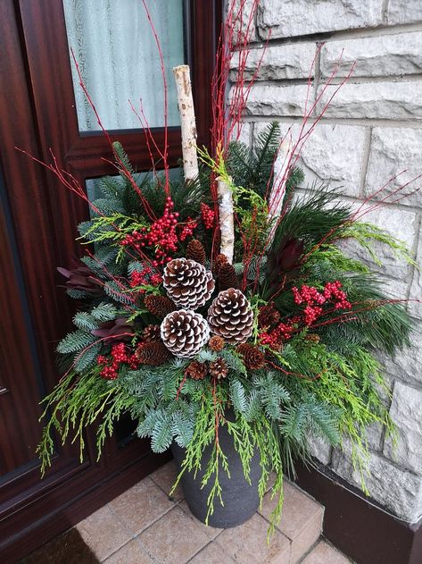 Diy Christmas Arrangements Front Porches, Diy Xmas Planters Outdoor, Christmas Greenery Planters, Christmas Porch Planters Front Doors, Porch Urns Christmas, Outdoor Christmas Decorations For Porch Flower Pots, How To Decorate Outdoor Flower Pots For Christmas, Christmas Potted Plants Outdoors, Porch Pots Ideas Christmas