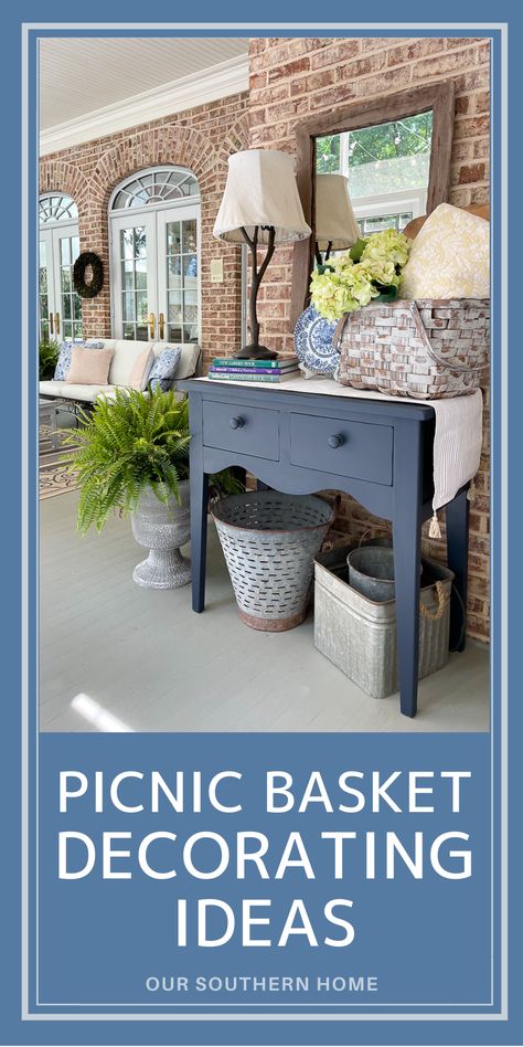 screened porch with a vignette created using a navy  buffet table and lovely picnic basket full of flowers and a quilt. Decorating With A Picnic Basket, Decorating With Picnic Baskets Ideas, Picnic Basket Decorating Ideas, Decorating With Picnic Baskets, Picnic Basket Decor Display, Picnic Baskets Ideas, Decorating With Old Picnic Baskets, Vintage Picnic Basket Decor Ideas, Decorating With Vintage Picnic Baskets