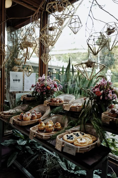 Fairy Bakery Aesthetic, Crystal Cafe Aesthetic, Witchy Pastries, Baking Witch Aesthetic, Forest Bakery Aesthetic, Magical Cafe Interior, Gothic Bakery Interior, Bakery With Plants, Witchy Bakery Aesthetic