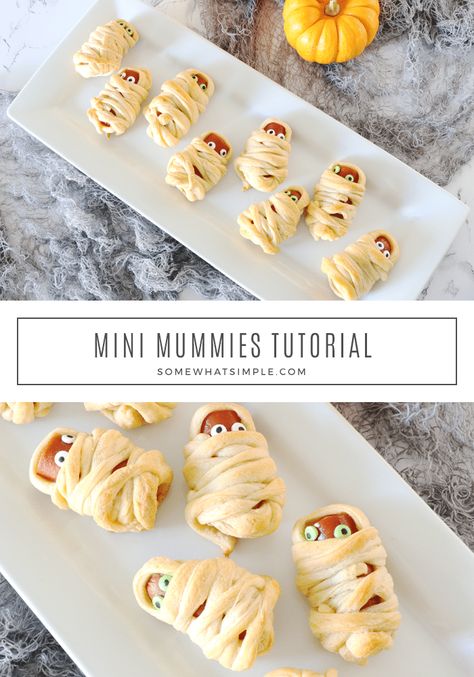 Mummy Hot Dogs are a hit with kids and Halloween party guests! They're a festive Halloween treat that's simple to make and delicious too! They're super easy to make by wrapping hot dogs in some crescent roll dough. They make the perfect Halloween snack or lunch recipe. via @somewhatsimple Mummy Dogs Recipe Crescent Rolls, Halloween Food Mummy Dogs, Mummy Hotdogs Crescent Rolls, Mini Mummy Dogs, Mini Hot Dog Mummies, Hot Dog Mummies Crescent Rolls, Crescent Roll Hot Dog Mummies, Mummy Mini Hotdogs, How To Make Mummy Hot Dogs