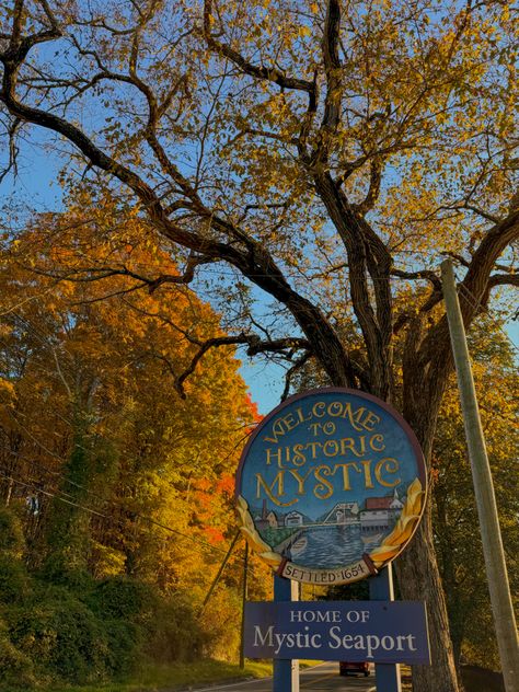 Fall colored trees with a mystic connecticut sign Mystic Connecticut Aesthetic, Hartford Connecticut Aesthetic, New Haven Connecticut Aesthetic, Mystic Connecticut Fall, Connecticut Autumn, Connecticut Aesthetic, Season Of The Sticks, Washington Connecticut, Connecticut Fall