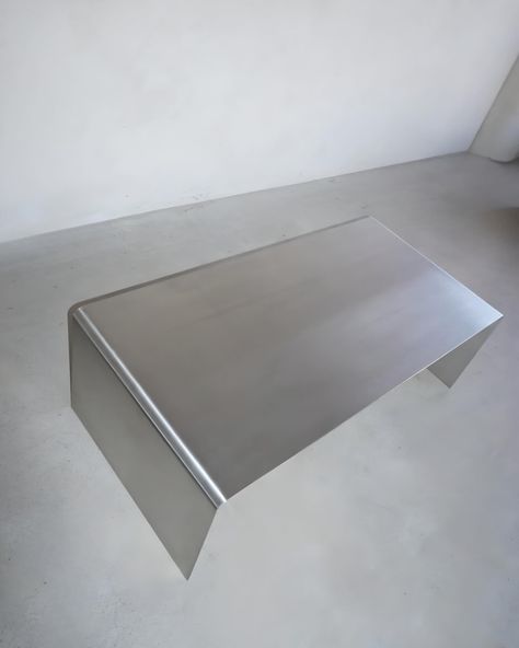 The most gorgeous and sleek stainless steel coffee table • Judd Coffee Table designed by HueGah Home🖤 Immerse yourself in the ultimate chrome vibe. Metal is IN🖤 Diy Metal Coffee Table, Chrome Furniture Living Room, Stainless Furniture, Nordic Apartment, Minimal Coffee Table, Organic Modern Home Decor, Aluminium Furniture, Chrome Furniture, Chrome Coffee Table